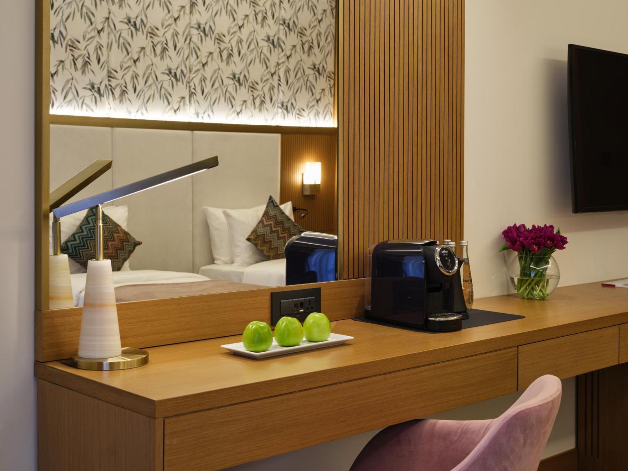 Qafqaz Riverside Hotel Gabala Exterior photo A Nespresso machine in a hotel room