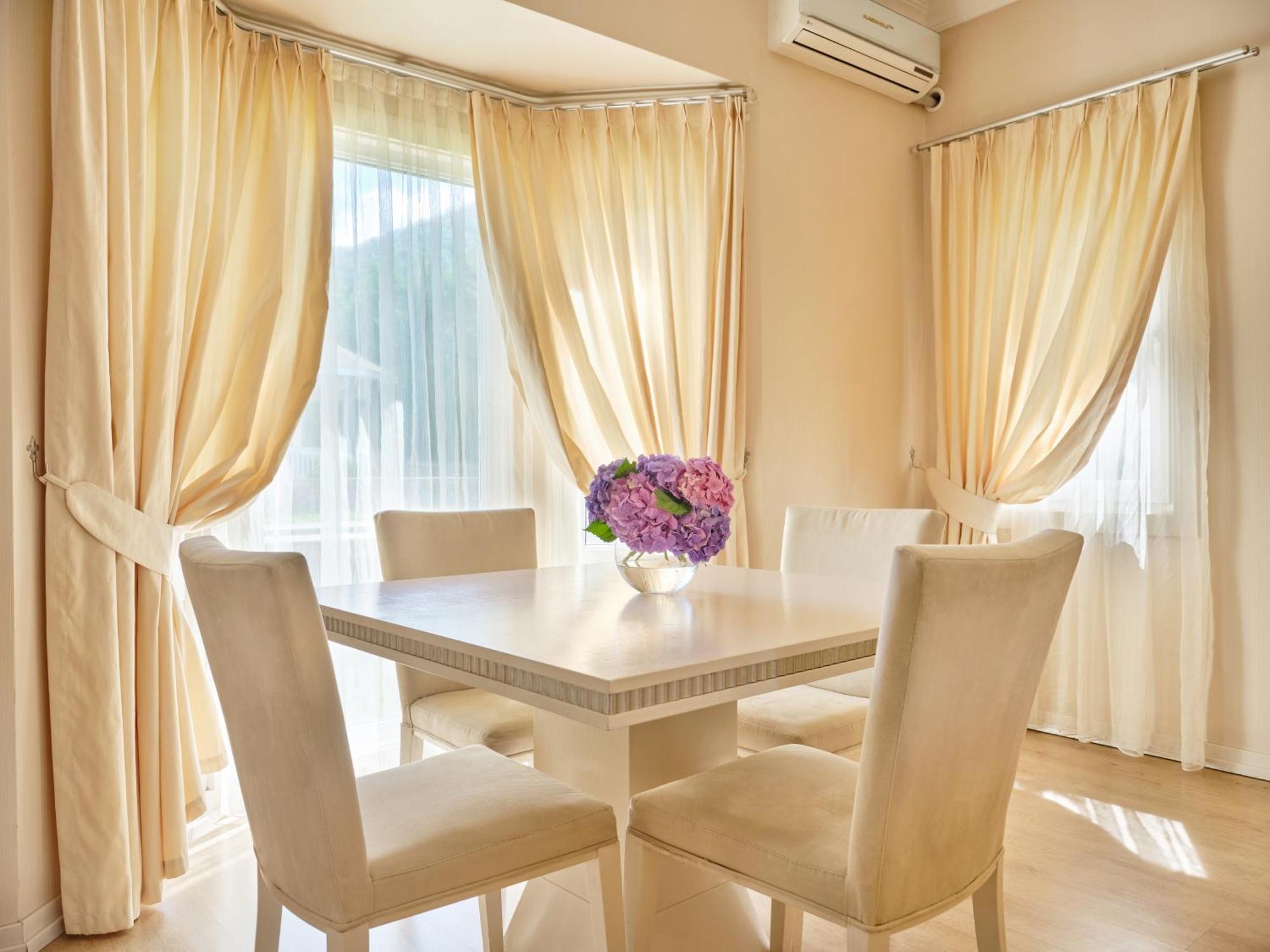 Qafqaz Riverside Hotel Gabala Exterior photo Curtains in a dining room