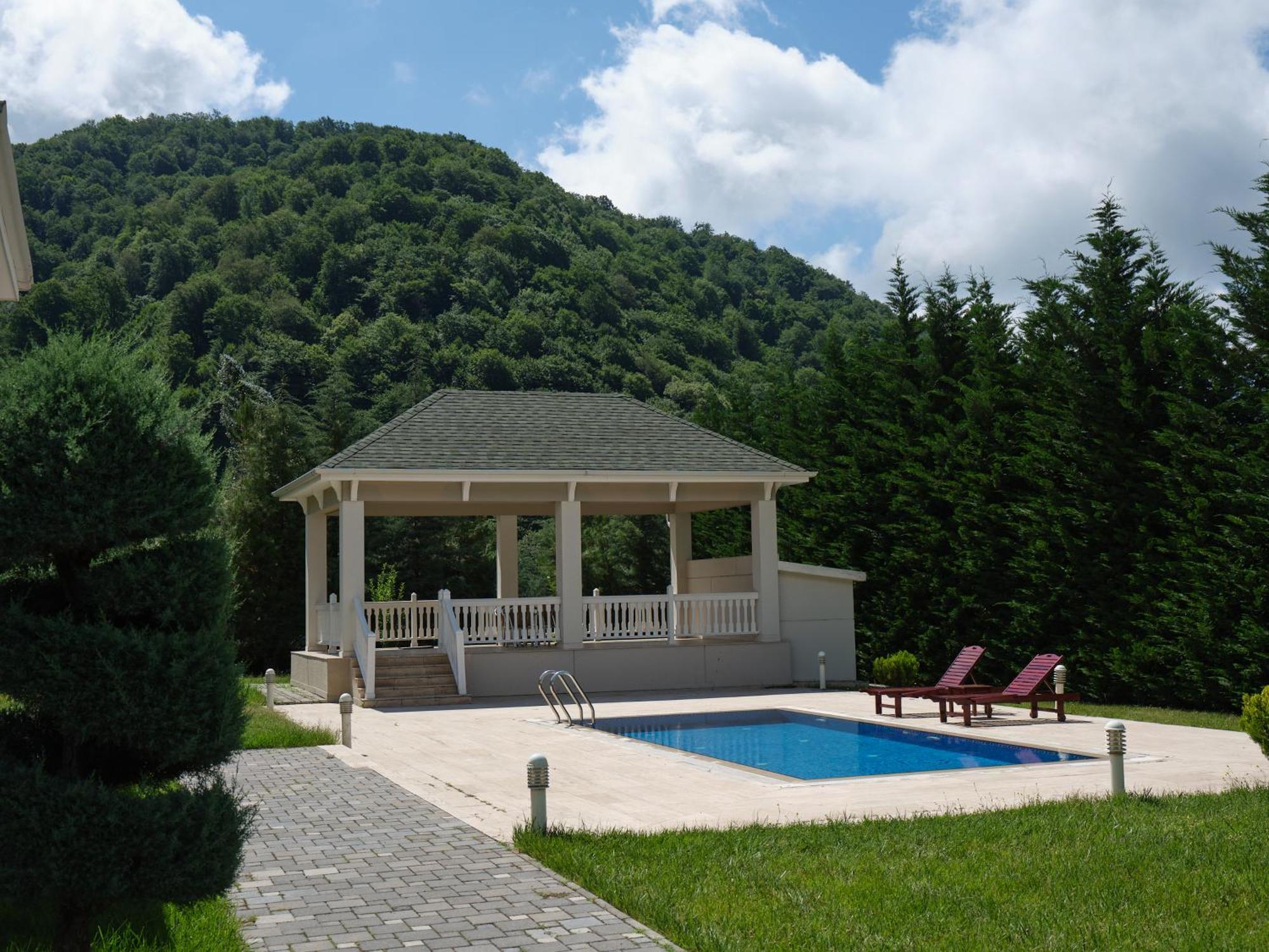 Qafqaz Riverside Hotel Gabala Exterior photo The swimming pool at the resort